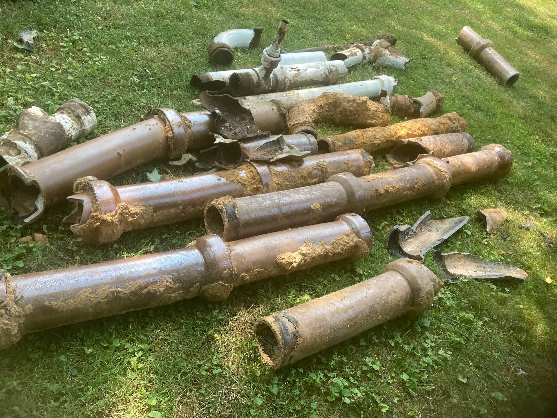 Rusted looking pipes in grass